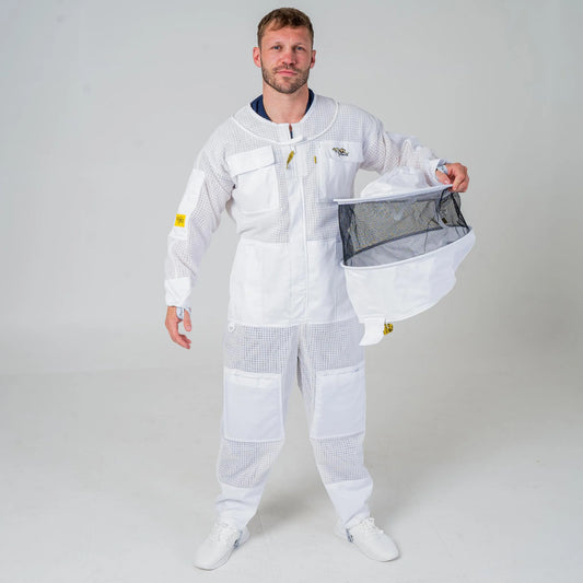 Man wearing OZ Armour white 3 layer beekeeping suit holding the detachable round hat veil, full length front view