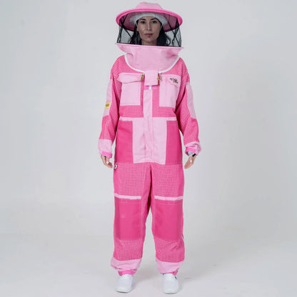 Woman wearing 3 layer mesh pink beekeeping suit with round veil hat, front view