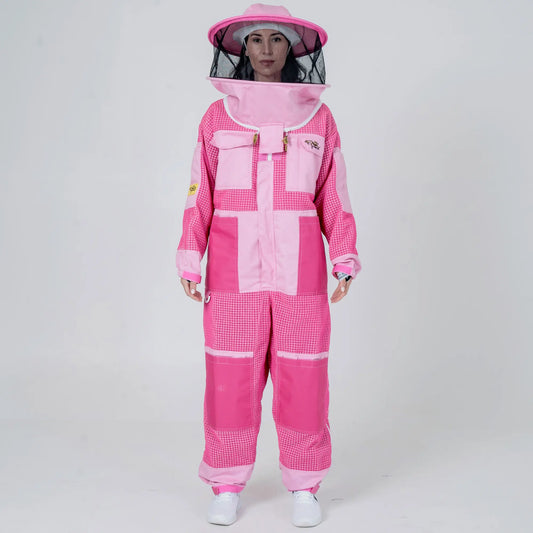 Woman wearing 3 layer mesh pink beekeeping suit with round veil hat, front view