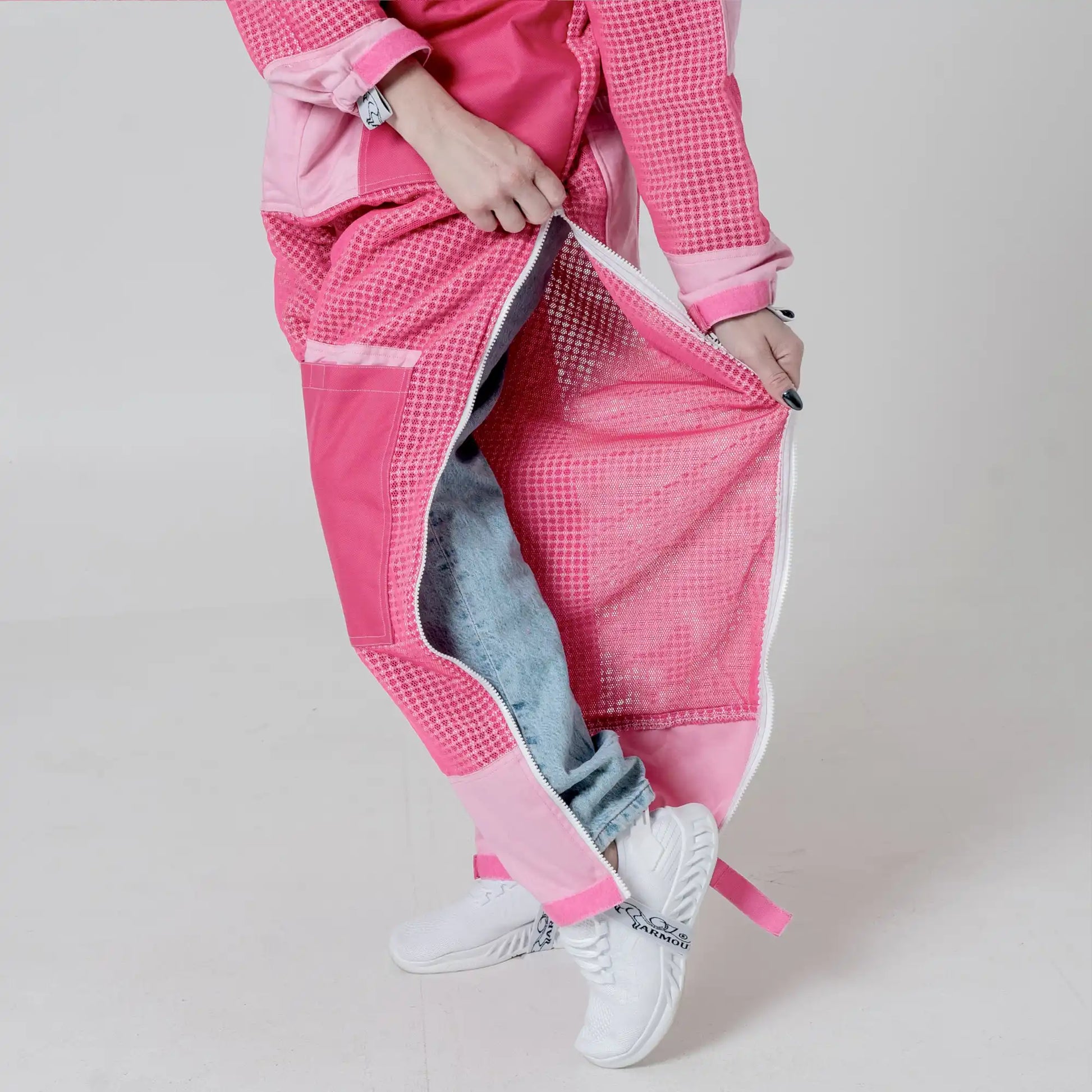Close up of leg vent zipper opened on the 3 layer mesh pink beekeeping suit showing mesh lining