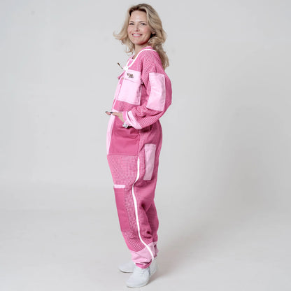 Side view of woman wearing 3 layer mesh pink beekeeping suit