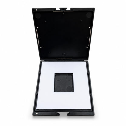 Black makeup compact with open lid 