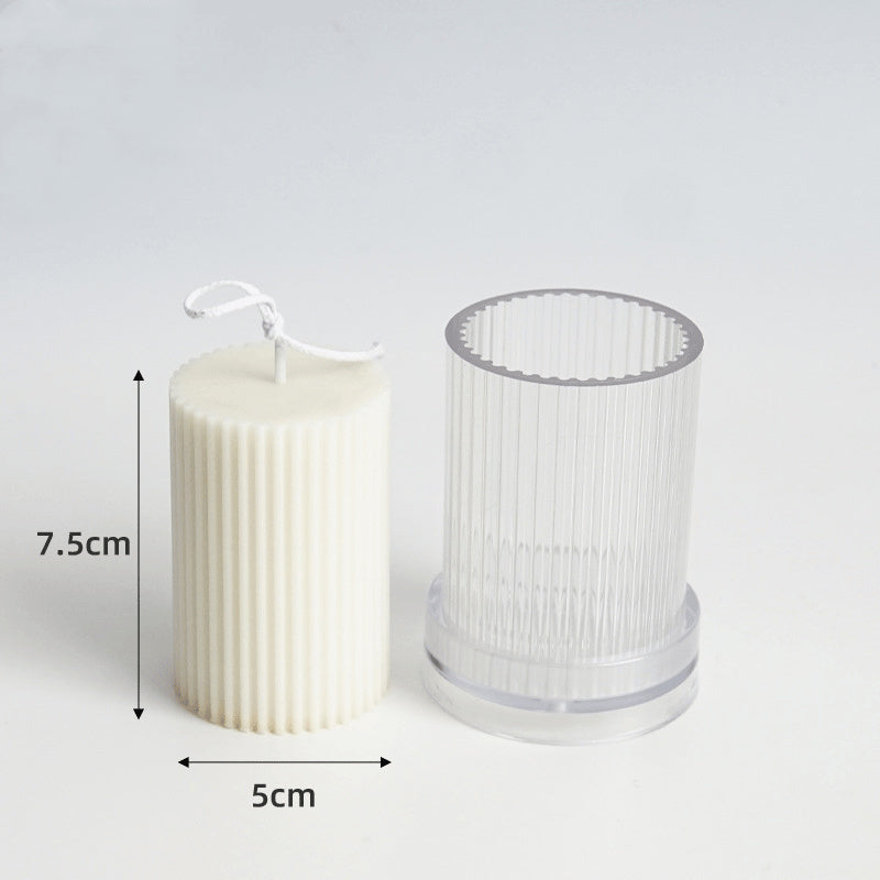 Cream candle beside clear silicone mould for DIY candle making