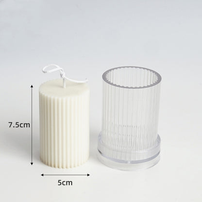 Cream candle beside clear silicone mould for DIY candle making