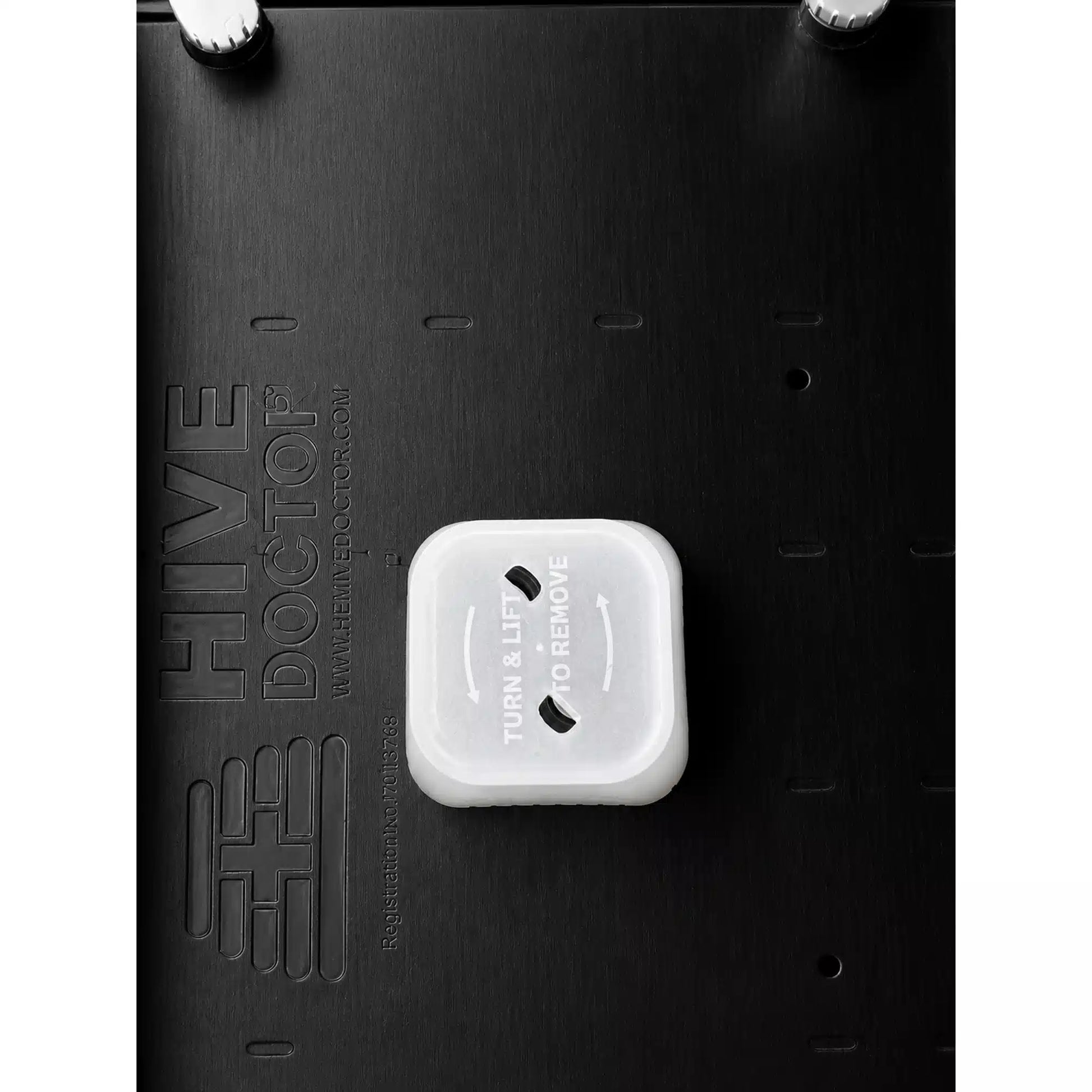 Hive Doctor Top Feeder designed for beekeeping, with feeding ports and a central white structure.