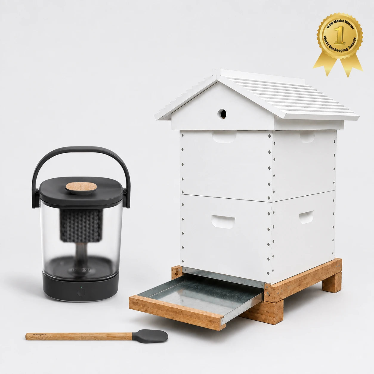 Hive to Harvest Starter Kit with assembled beehive, Micro Honey Harvester, and stirring spoon