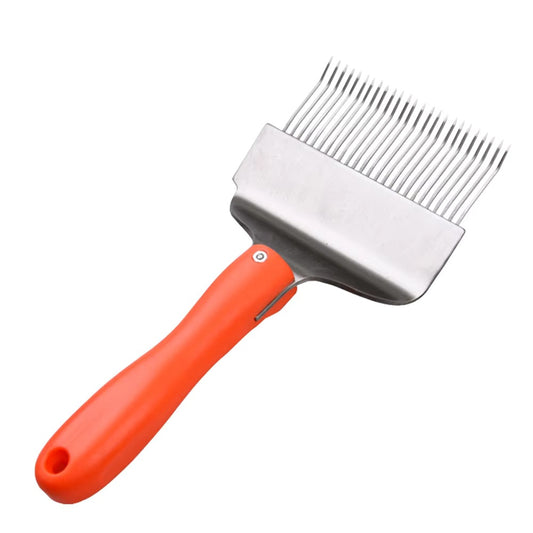 Close-up of honey uncapping fork tines for beekeeping wax removal