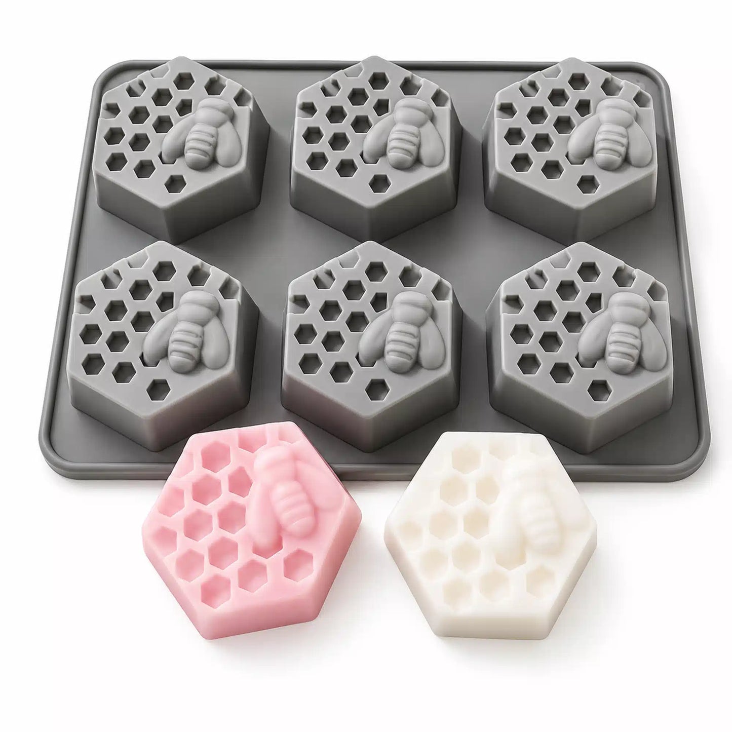Six cavity honeycomb candle mould set with finished hexagon candles in different colors