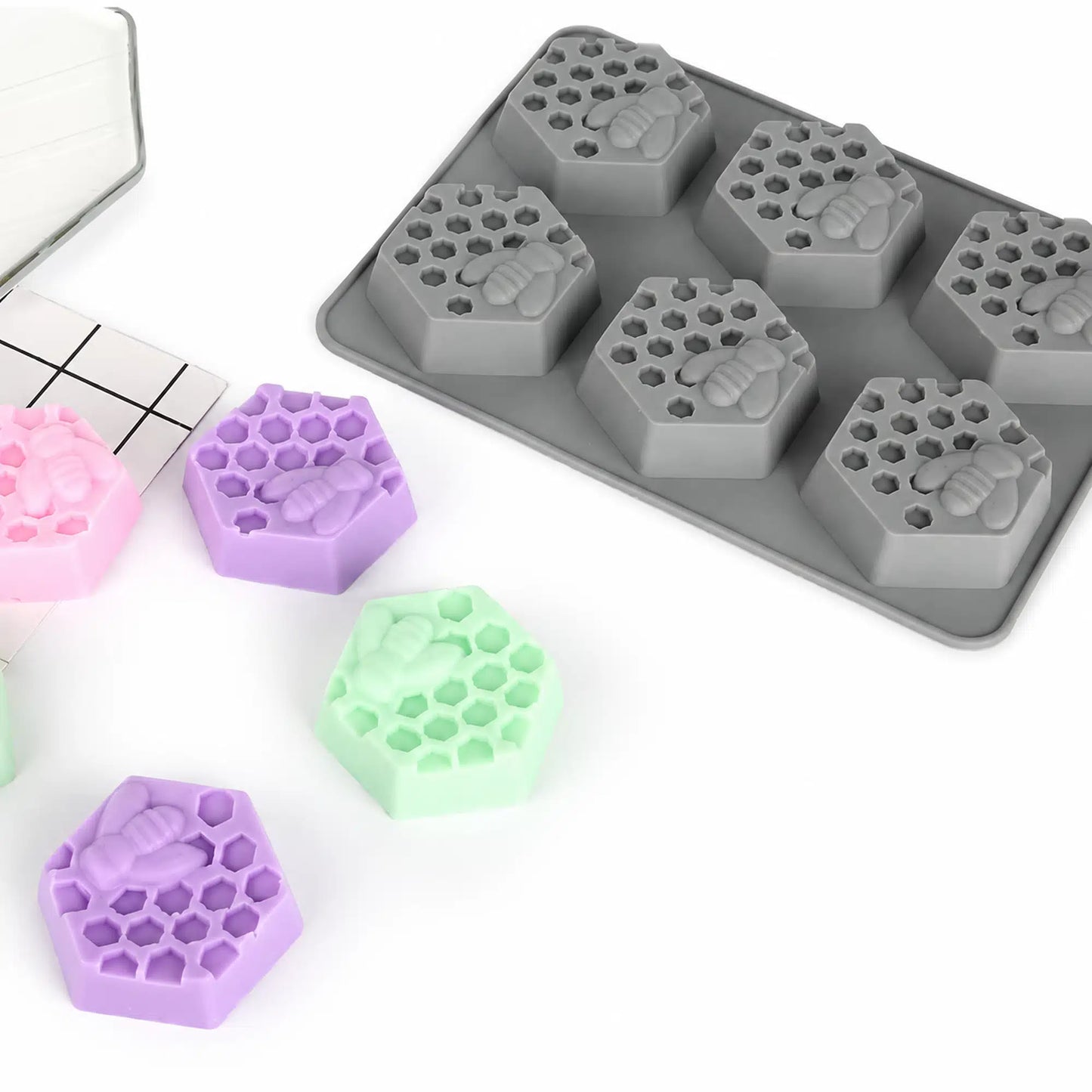 Flexible 6 in 1 honeycomb candle mould with finished candles in assorted colors