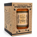 organic-honey-gift-box-side-story.webpHumming Meadow Certified Organic Honey jar in a kraft gift box with the brand story printed on the side panel