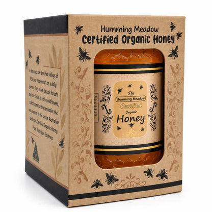 organic-honey-gift-box-side-story.webpHumming Meadow Certified Organic Honey jar in a kraft gift box with the brand story printed on the side panel