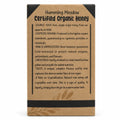 Back of Humming Meadow organic honey box listing source, raw, unfiltered and crystallisation details