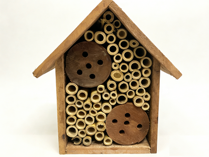 Wooden native bee hive with bamboo nesting tubes and wooden inserts