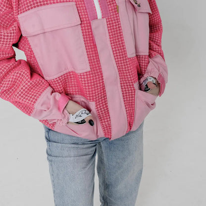 Close up of the velcro wrist straps and embroidered OZ Armour logo patch on the pink 3 layer beekeeping jacket
