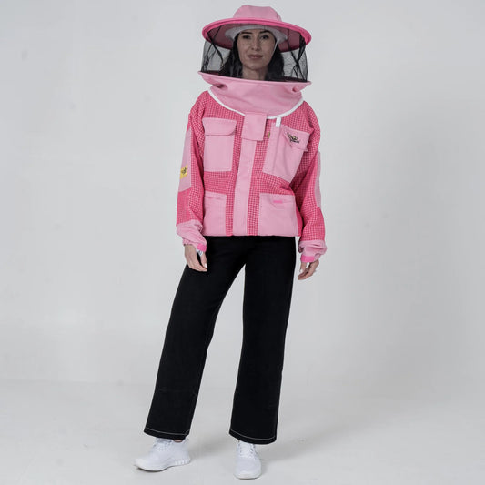 Woman wearing OZ Armour pink 3 layer mesh beekeeping jacket with round hat veil hood up, front standing pose
