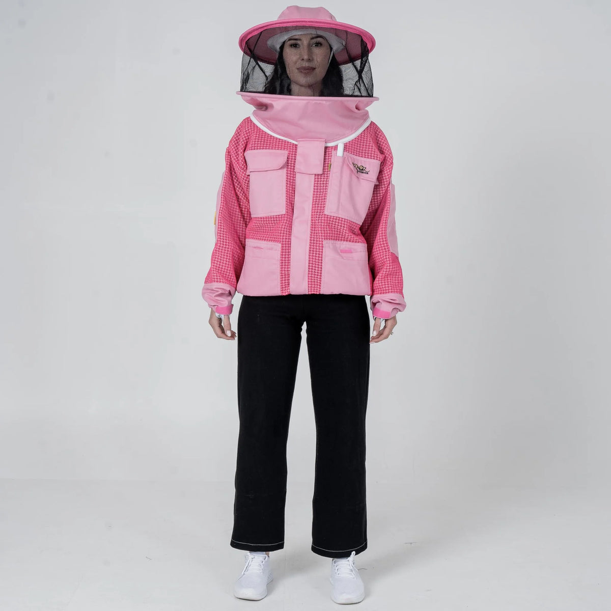Woman wearing OZ Armour pink 3 layer mesh beekeeping jacket with round hat veil hood up, front view
