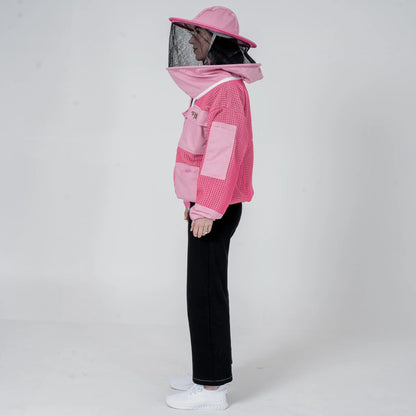 Woman wearing OZ Armour pink 3 layer mesh beekeeping jacket with round hat veil hood up, side view