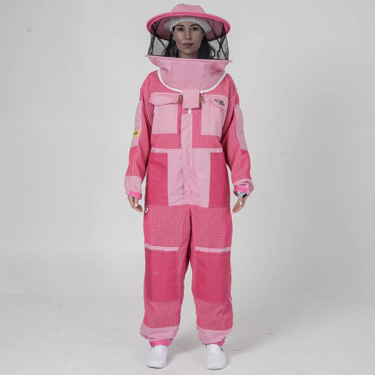 Woman wearing OZ Armour pink 3 layer mesh beekeeping suit with round hat veil hood up, front view