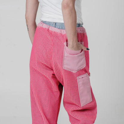Close up of the rear pocket and hive tool pocket on the OZ Armour pink 3 layer beekeeping trousers, back view