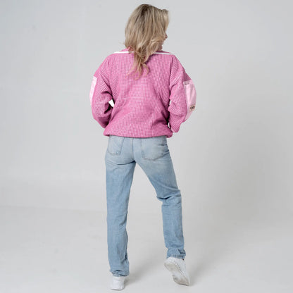 Woman wearing OZ ARMOUR pink beekeeping jacket over jeans, back view full body