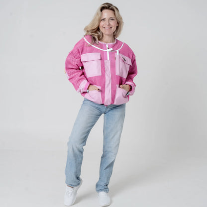 Woman wearing OZ ARMOUR pink beekeeping jacket over jeans, front view full body