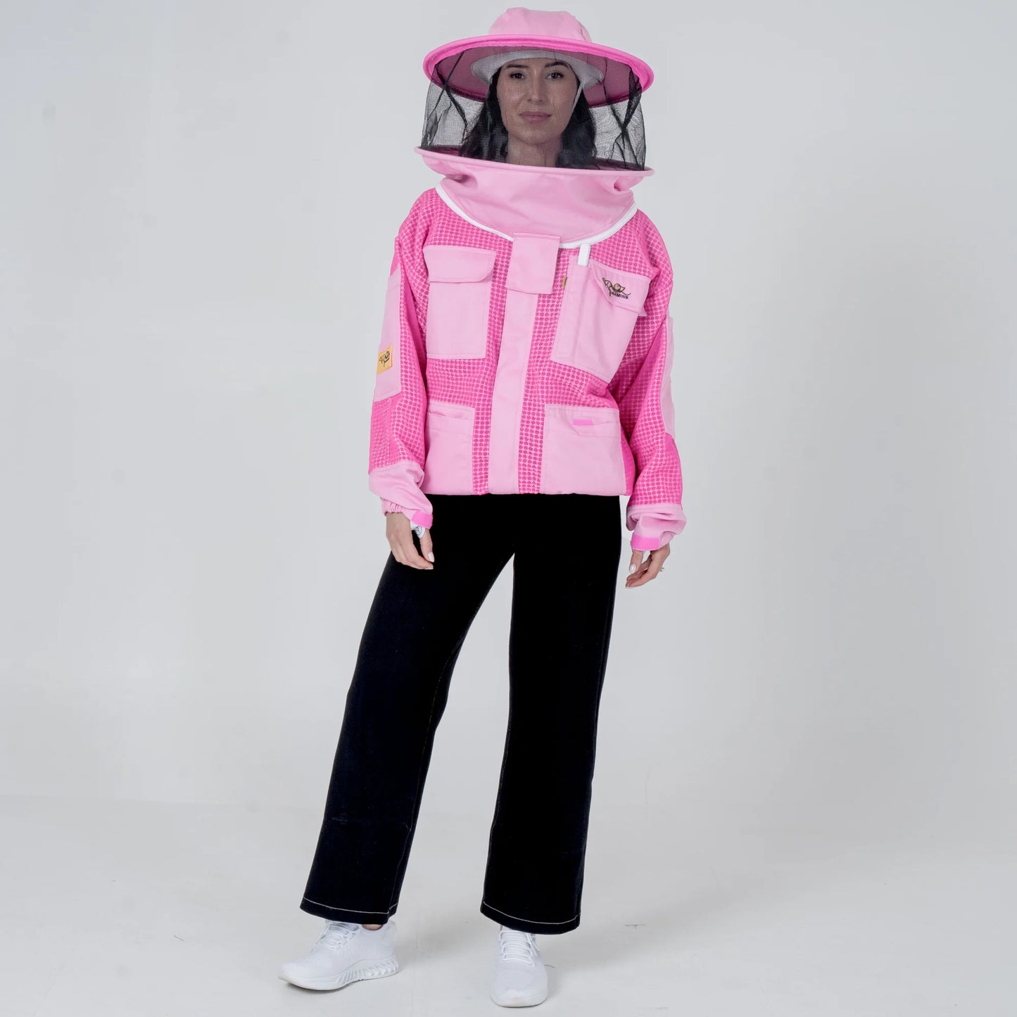 Woman wearing OZ ARMOUR pink beekeeping jacket with round veil hat