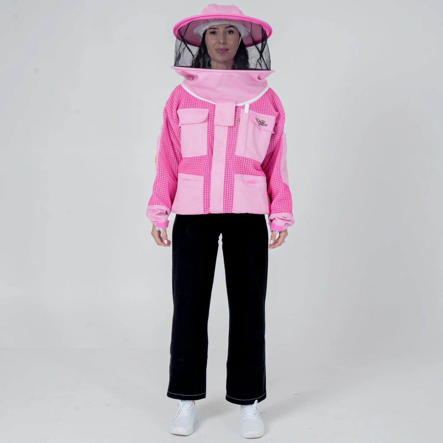 Woman wearing OZ ARMOUR pink beekeeping jacket with round veil hat, front view full body
