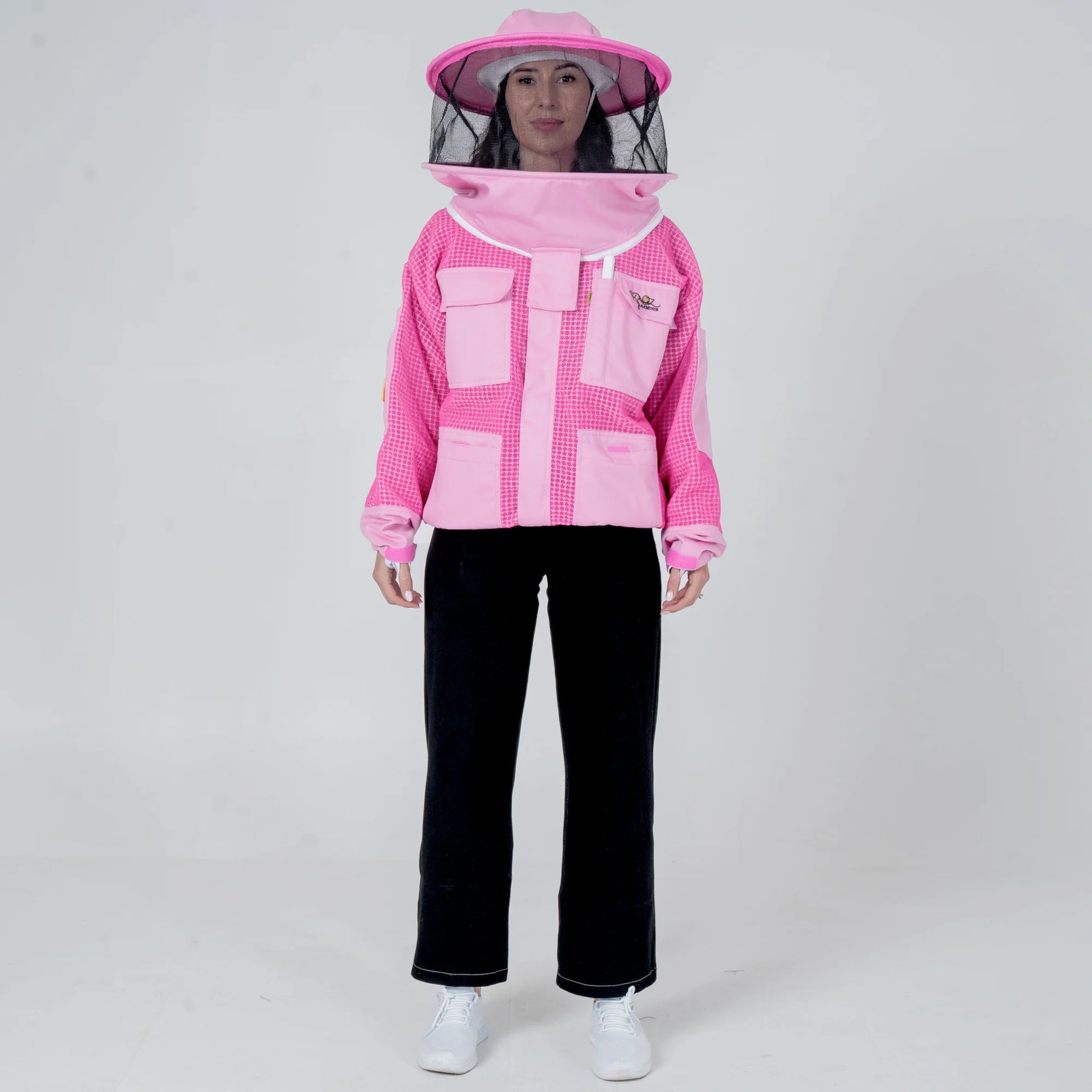 Woman wearing OZ ARMOUR pink beekeeping jacket with round veil hat, front view full body
