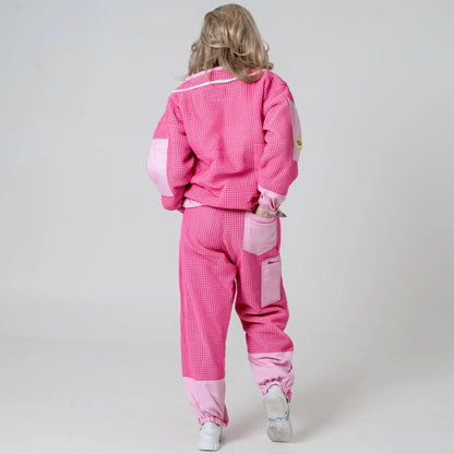 Back view of woman walking in OZ ARMOUR pink beekeeping jacket and trousers set 