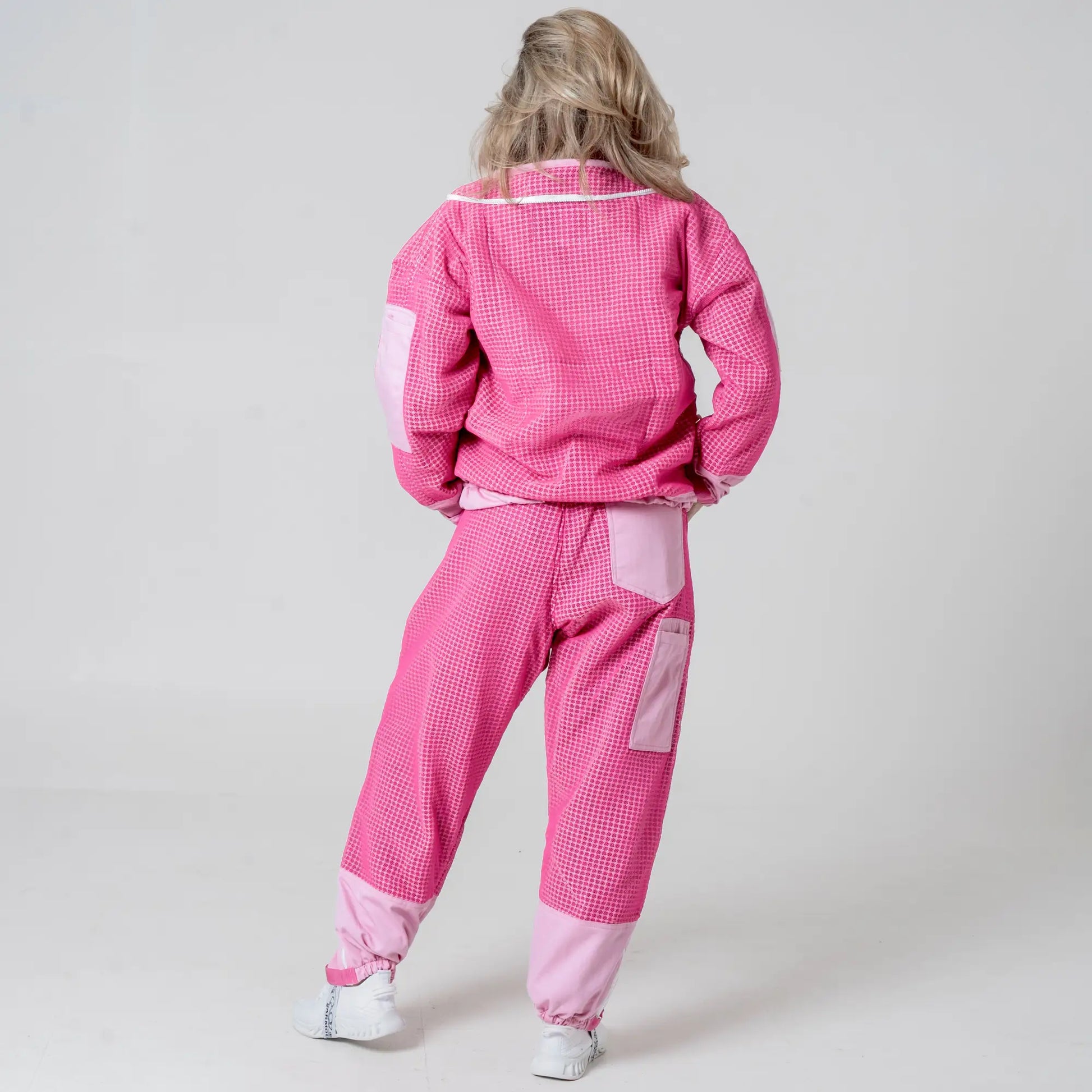 Back view of woman wearing OZ ARMOUR pink beekeeping jacket and trousers set 