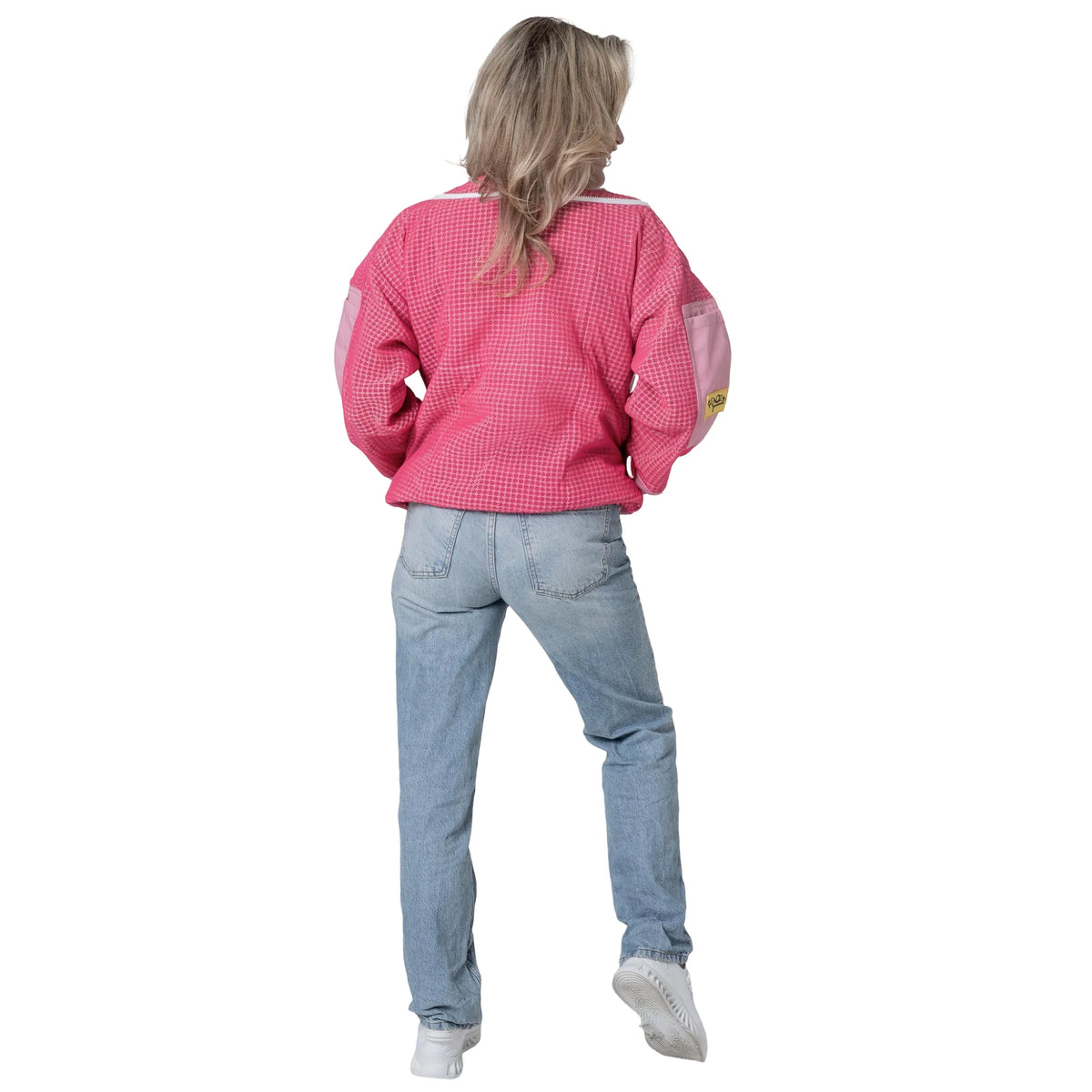 Woman wearing OZ ARMOUR pink beekeeping jacket with hood down, back view