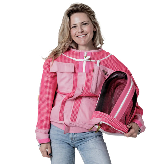 Woman wearing OZ ARMOUR pink beekeeping jacket while holding the detached fencing veil