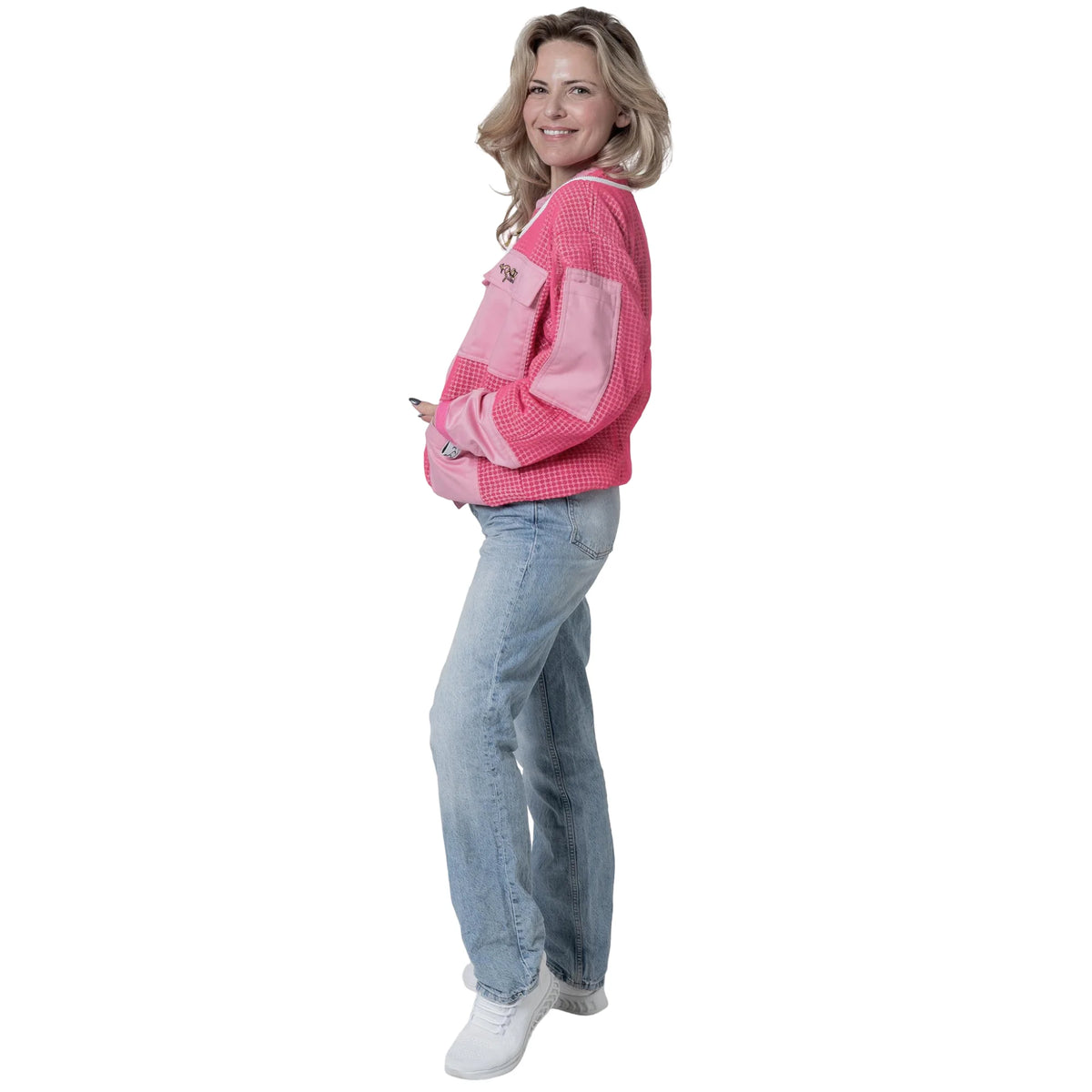 Woman wearing OZ ARMOUR pink beekeeping jacket with hood down, side view