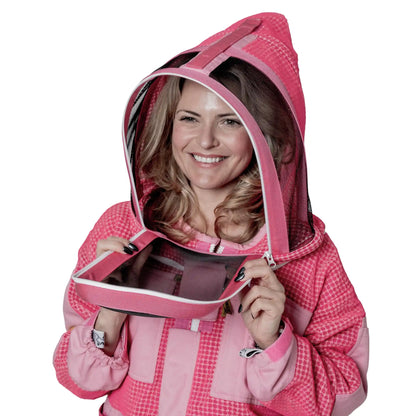 Woman holding open the unzipped fencing veil on the OZ ARMOUR pink jacket and trousers set