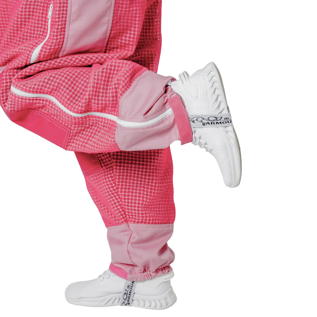  Close up of ankle cuff while kicking, on the 3 Layer OZ Armour pink suit