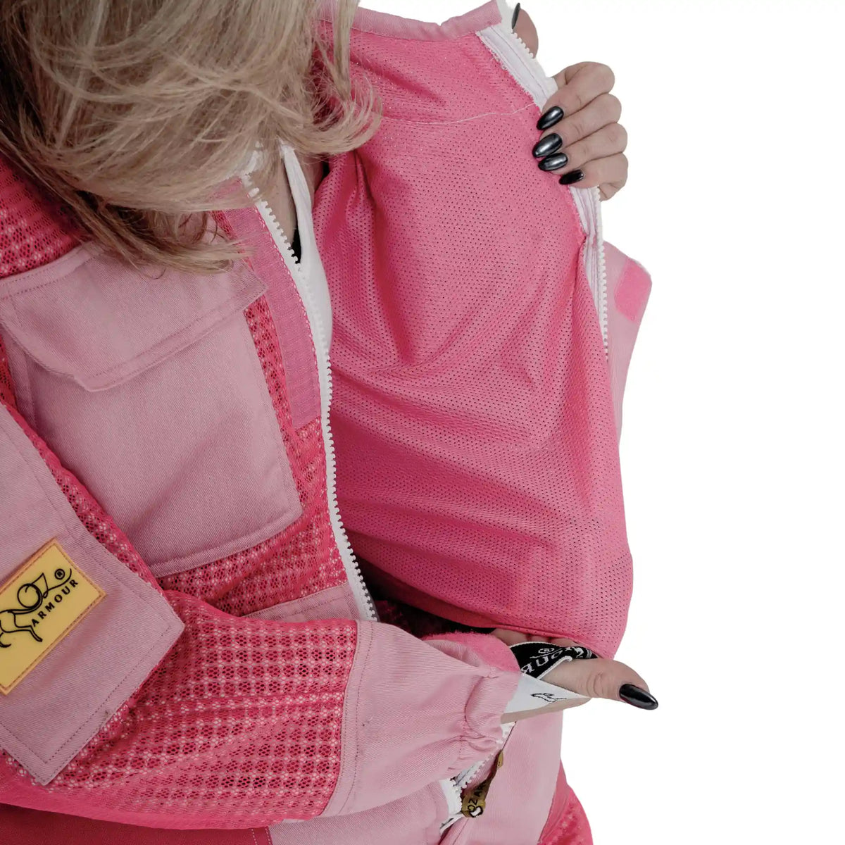 Close up of collar and zip pull on the 3 Layer OZ Armour pink suit