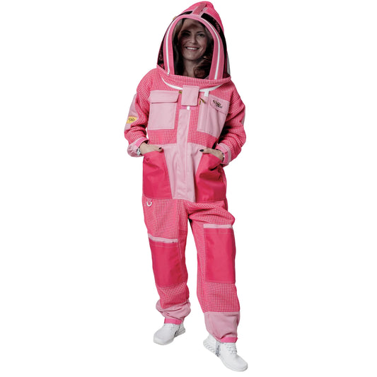 Woman wearing 3 Layer OZ Armour pink suit with fencing veil hood up, front view