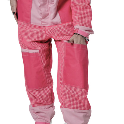 Woman wearing 3 Layer OZ Armour pink suit with hands on hips, front view