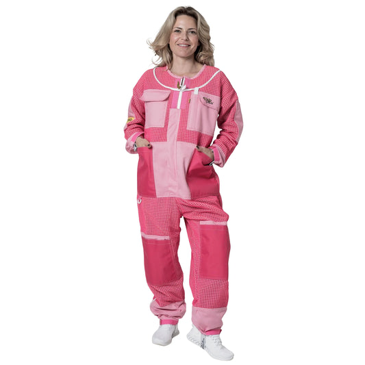 Woman wearing 3 Layer OZ Armour pink suit with hood down, front view