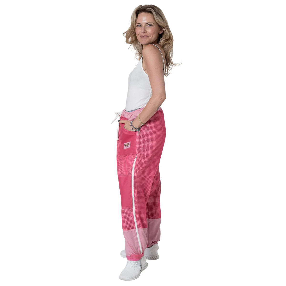 Woman wearing OZ ARMOUR pink beekeeping trousers, back three quarter view