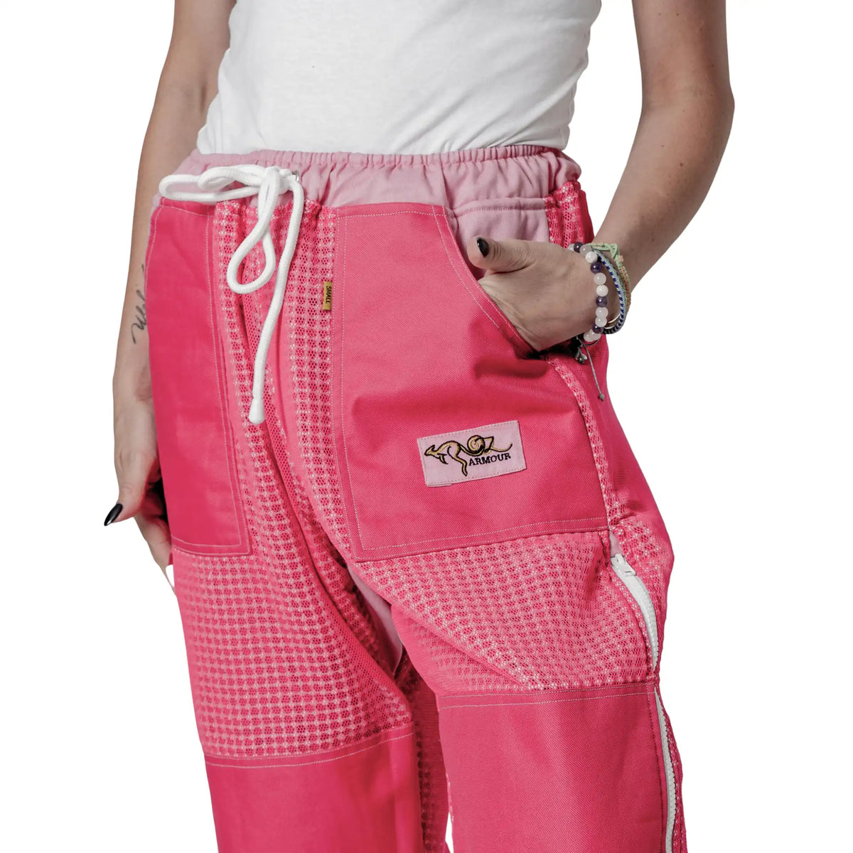 Close up of waist pocket with OZ Armour logo on the pink beekeeping trousers