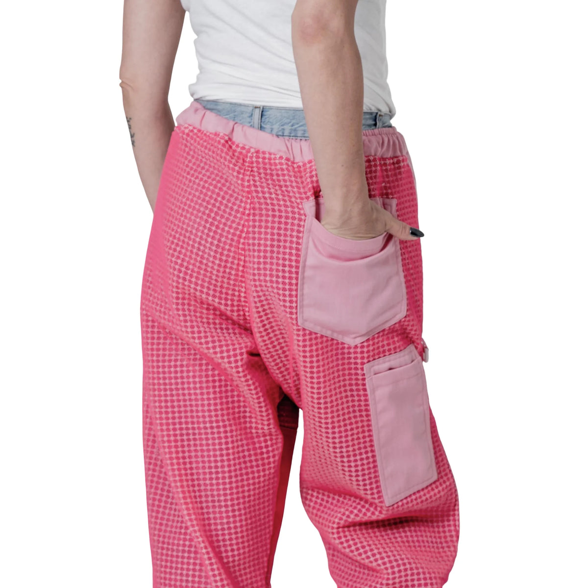 Close up of waist pocket holding a pencil on the pink beekeeping trousers