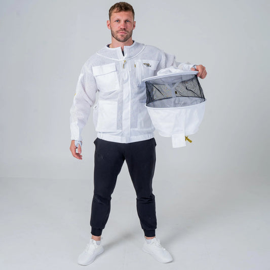 Man wearing OZ Armour white 3 layer beekeeping jacket holding the detachable round hat veil, full length front view