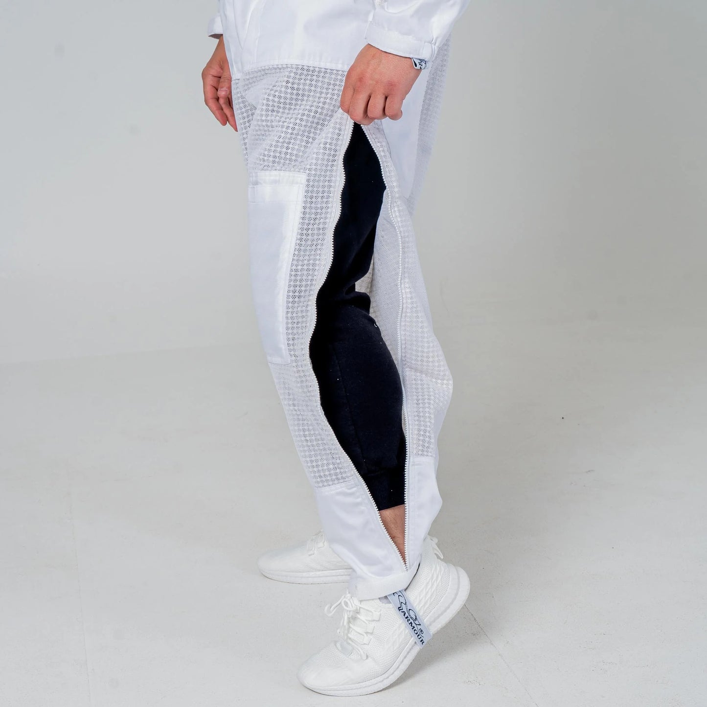 Close up of the open ankle zip on the leg of the OZ Armour white 3 layer beekeeping suit