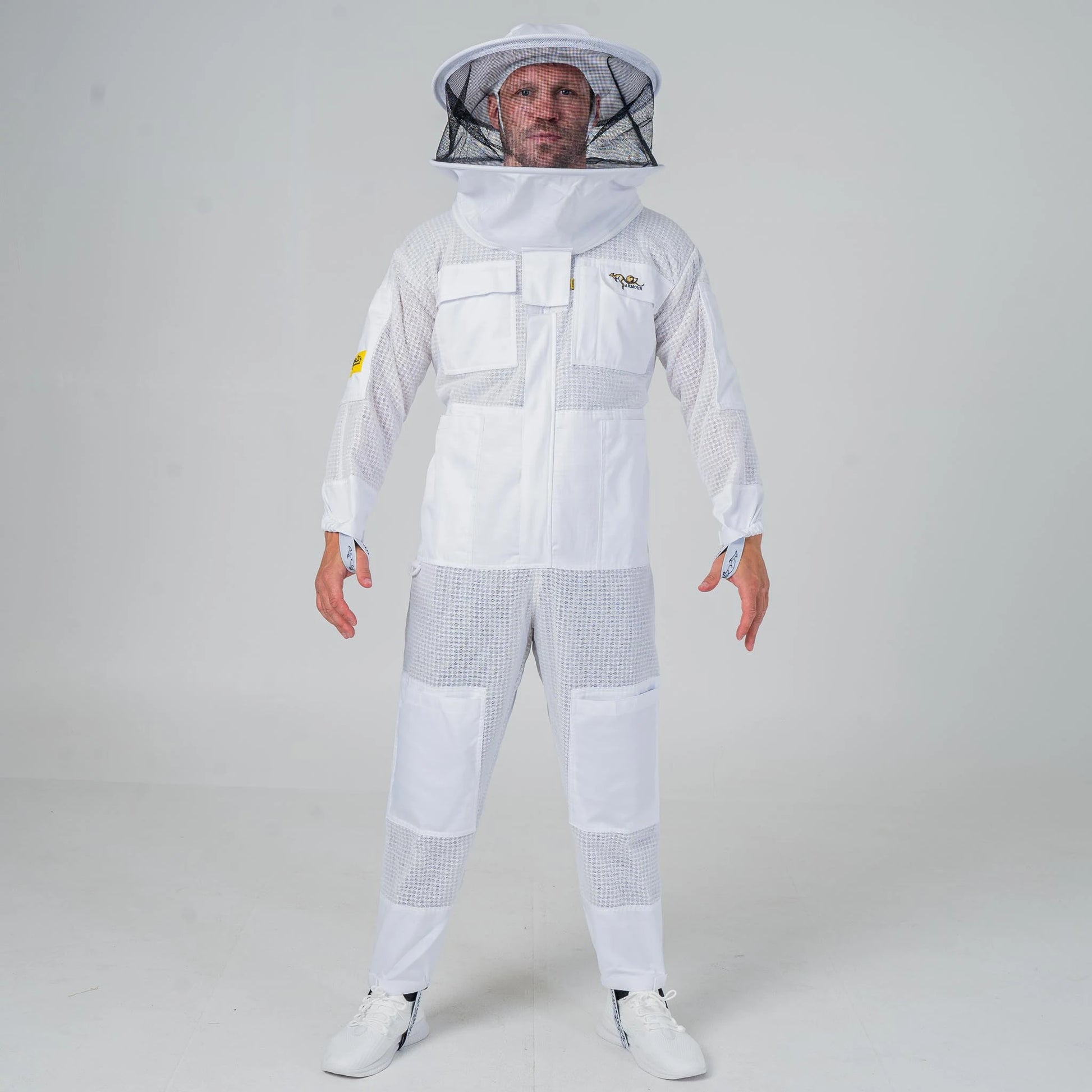 Man wearing OZ Armour white 3 layer beekeeping suit with round hat veil, full length front view