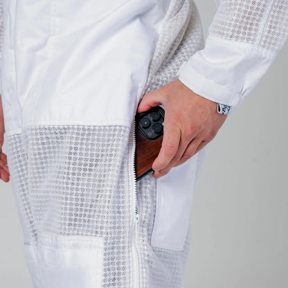 Close up of the thigh pocket holding a phone on the OZ Armour white 3 layer beekeeping suit