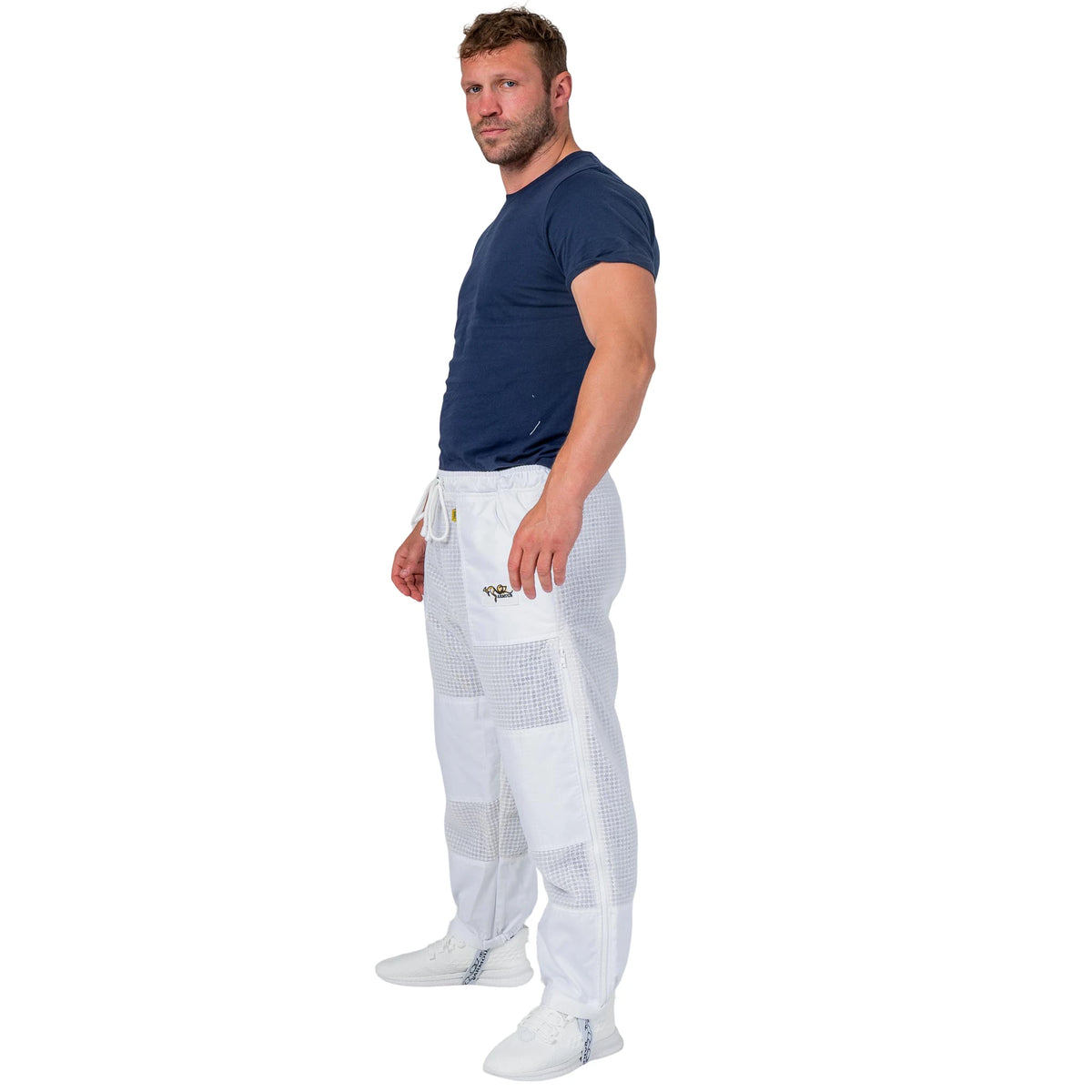  Man wearing the OZ ARMOUR 3 Layer Mesh Beekeeping Trousers, full body side view