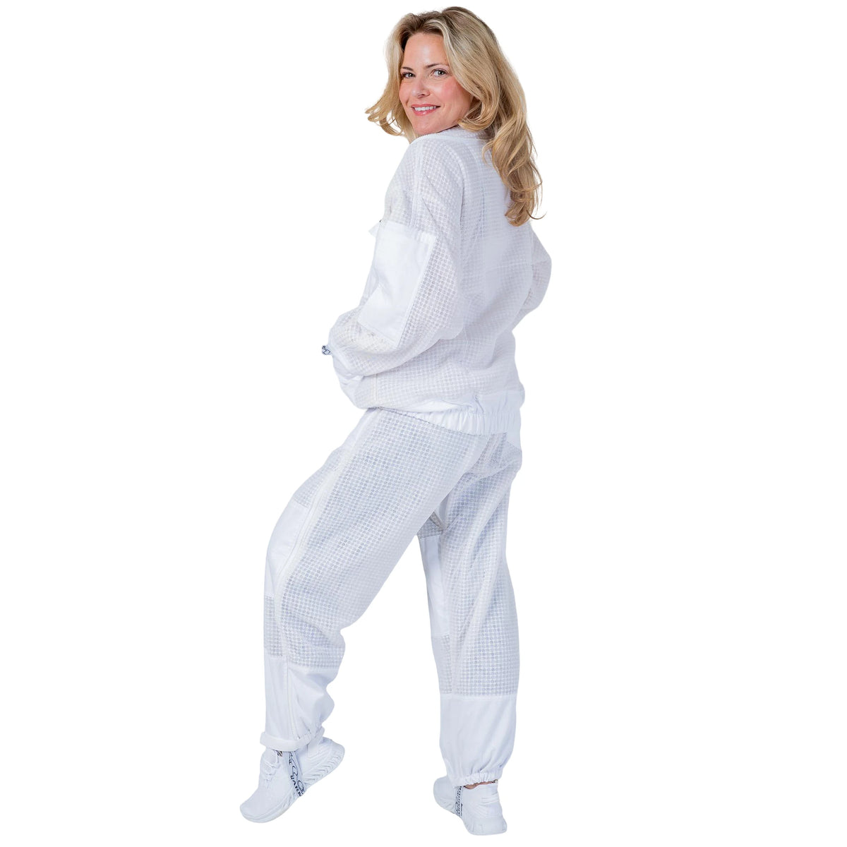 Woman wearing the OZ ARMOUR Beekeeping Jacket and Trouser Set with Fencing Veil, full body side view, hood down

