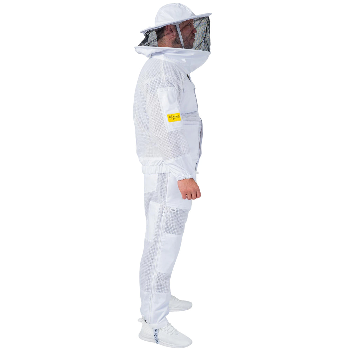 Man wearing the OZ ARMOUR Beekeeping Jacket and Trouser Set with Round Veil, full body walking side view, hood up