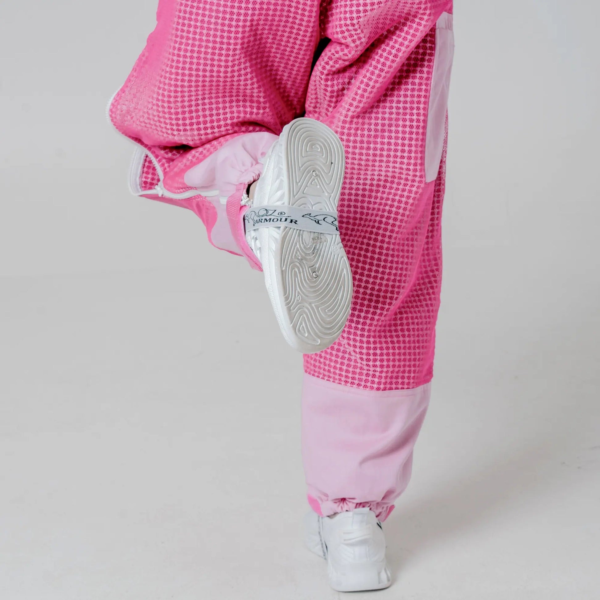 Close up of ankle cuff and elastic strap on the pink beekeeping trousers